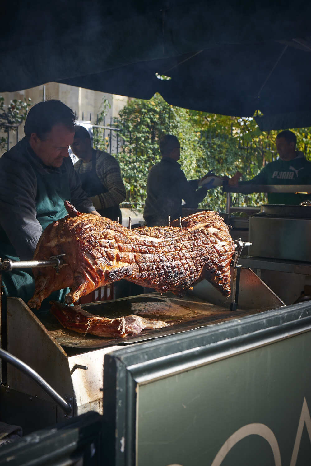 Whole hog roasting on the spit at a Roast Hog event